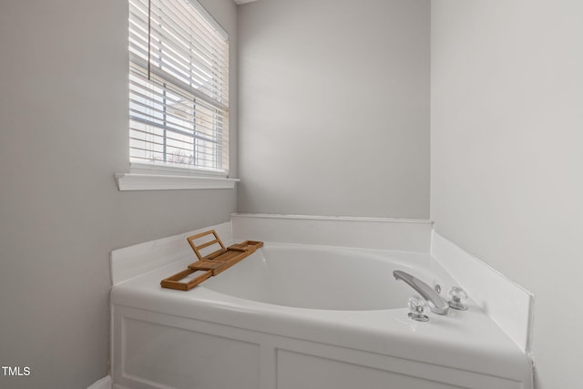 bathroom featuring a garden tub