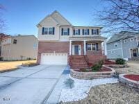 view of front of home with an attached garage and driveway