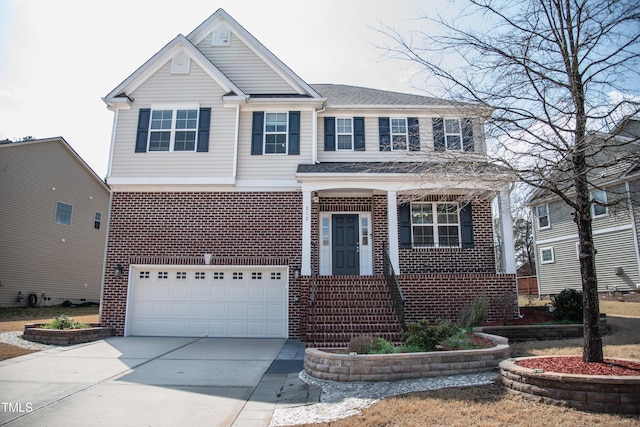 view of front of property with an attached garage, brick siding, and driveway