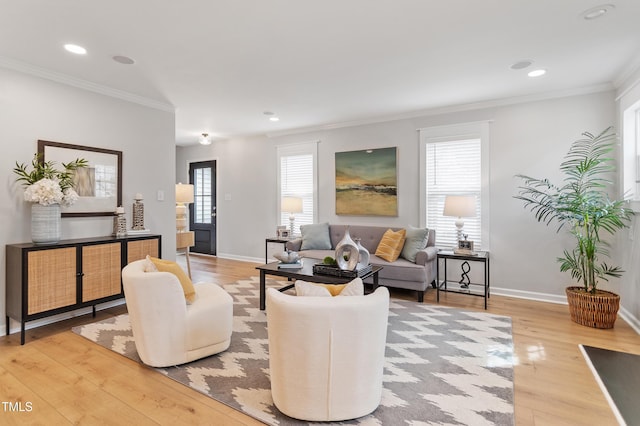 living room featuring recessed lighting, crown molding, baseboards, and wood finished floors