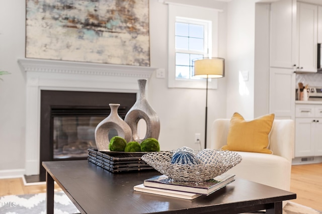 interior details featuring baseboards and wood finished floors