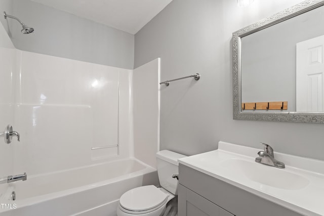 full bathroom featuring vanity, bathing tub / shower combination, and toilet