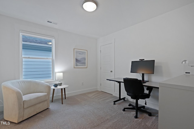 carpeted home office with visible vents and baseboards