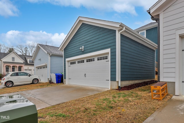 view of side of property with an outbuilding and a garage