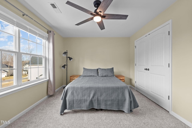 bedroom with visible vents, ceiling fan, baseboards, and carpet