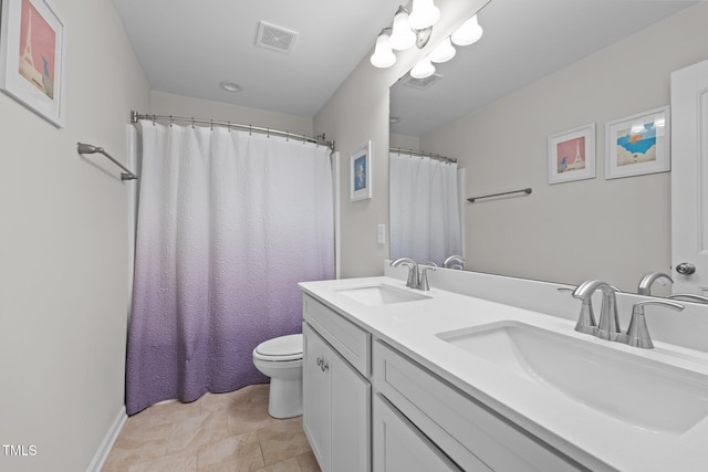 bathroom featuring a sink, visible vents, and toilet