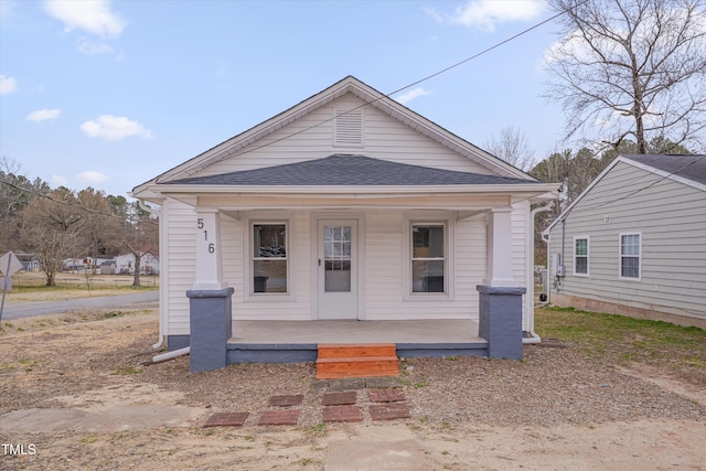 view of front of house featuring a porch and a shingled roof