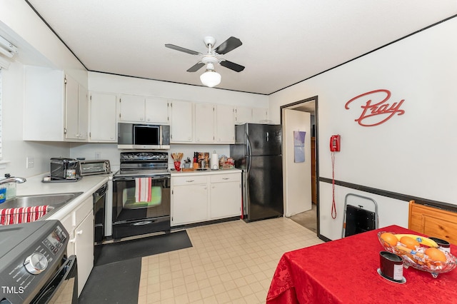 kitchen with a ceiling fan, a sink, black appliances, white cabinets, and light countertops