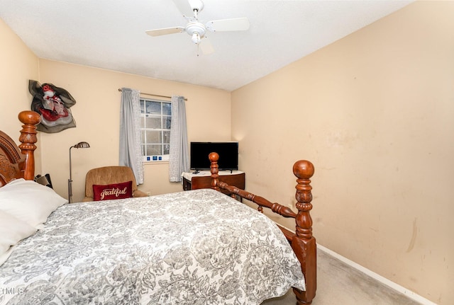 carpeted bedroom featuring baseboards and ceiling fan