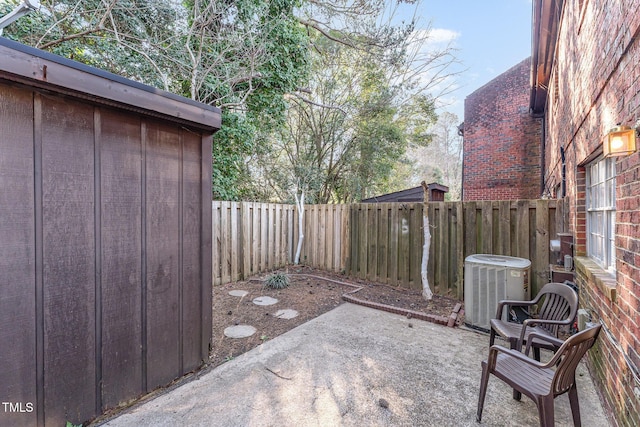 view of patio with central AC unit and a fenced backyard