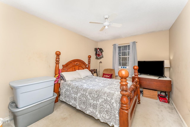 carpeted bedroom featuring a ceiling fan and baseboards