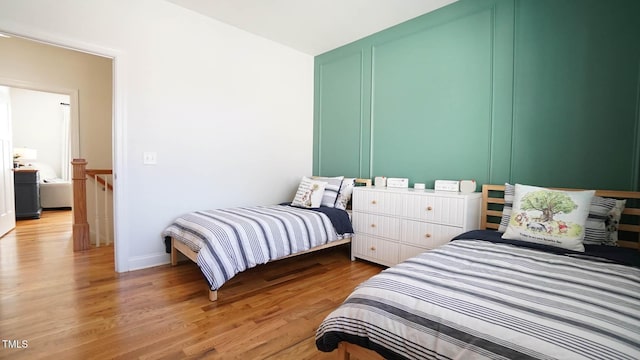 bedroom featuring light wood-style flooring