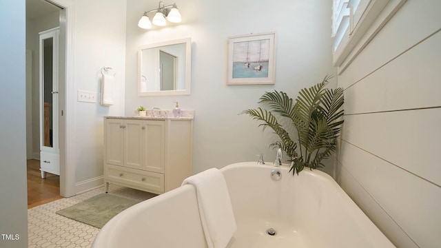 bathroom with a freestanding bath and vanity