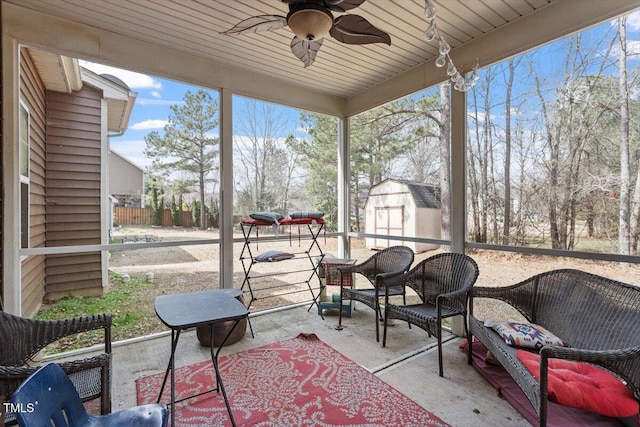 sunroom featuring ceiling fan