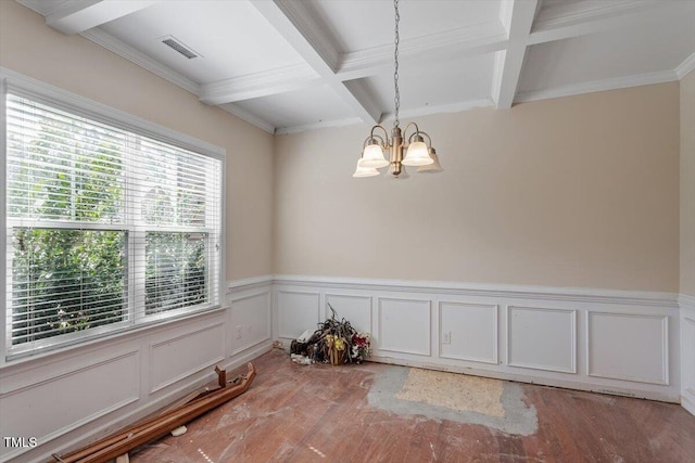 unfurnished dining area with light wood-style floors, beamed ceiling, a notable chandelier, and coffered ceiling