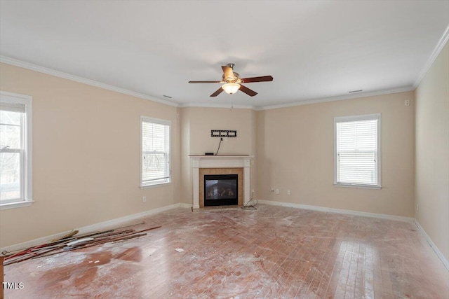 unfurnished living room featuring plenty of natural light, baseboards, and ceiling fan