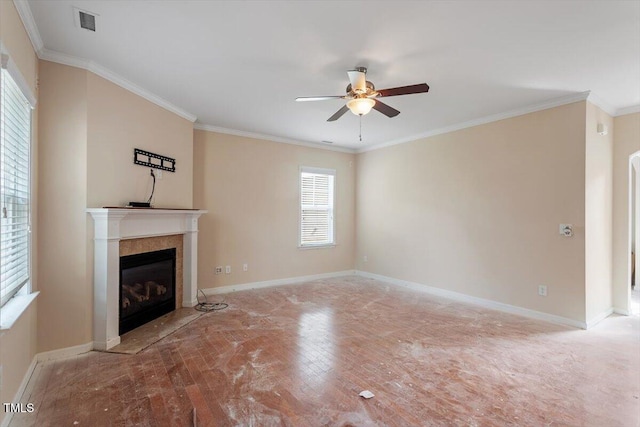 unfurnished living room featuring a fireplace with flush hearth, baseboards, crown molding, and ceiling fan