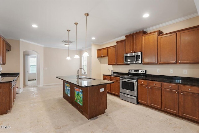 kitchen with arched walkways, ornamental molding, appliances with stainless steel finishes, and a sink