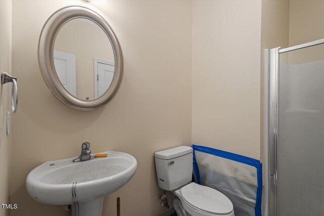 bathroom with toilet and a sink