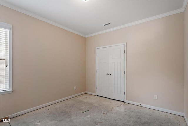 unfurnished bedroom with baseboards, visible vents, concrete flooring, and ornamental molding