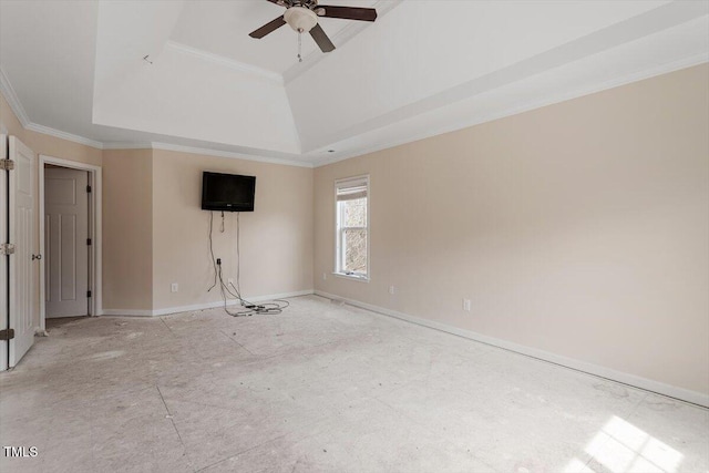 empty room with baseboards, a raised ceiling, ceiling fan, and ornamental molding