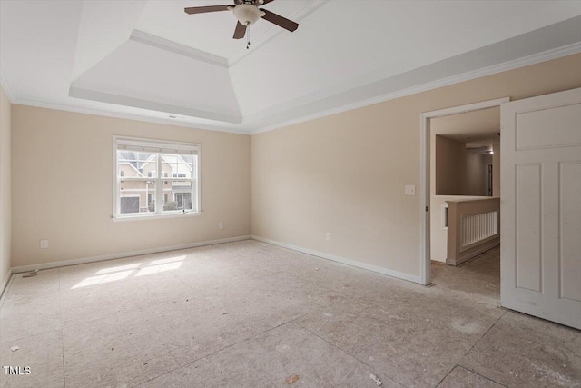 spare room with baseboards, a ceiling fan, and ornamental molding