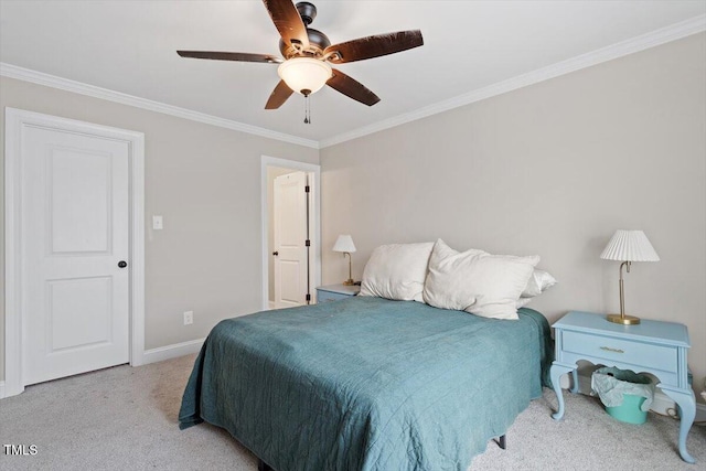 bedroom featuring baseboards, a ceiling fan, carpet flooring, and crown molding