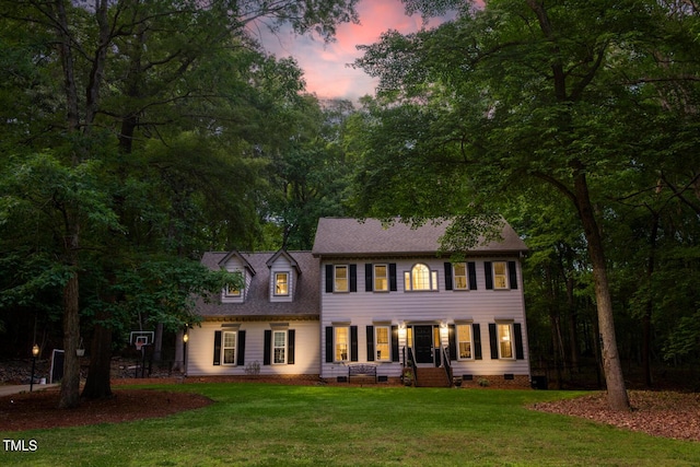 colonial home featuring crawl space and a front yard