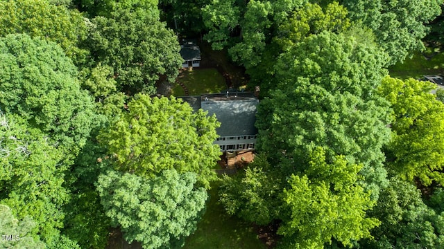 aerial view featuring a wooded view