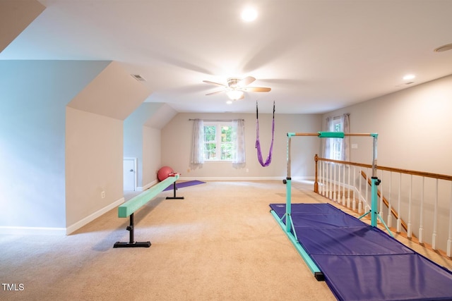 workout area with baseboards, visible vents, carpet floors, and ceiling fan