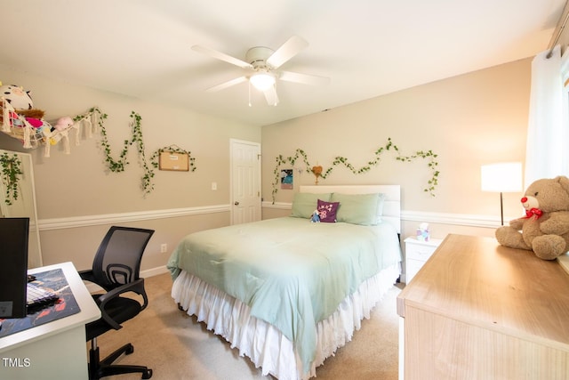 bedroom featuring light carpet, baseboards, and a ceiling fan