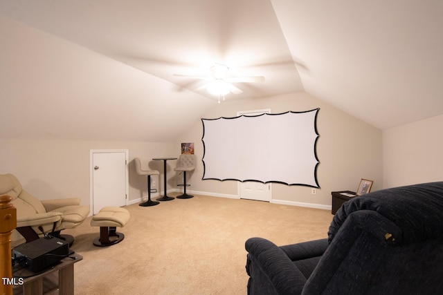 cinema room with lofted ceiling, carpet flooring, and baseboards