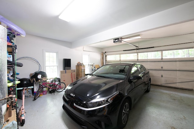 garage featuring a garage door opener