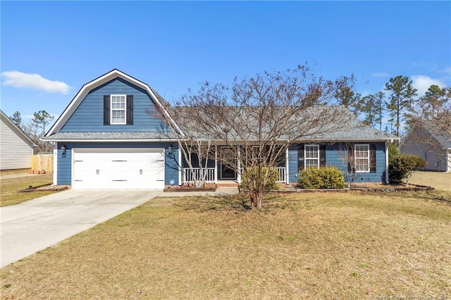 view of front of house featuring covered porch, a gambrel roof, driveway, and a front yard