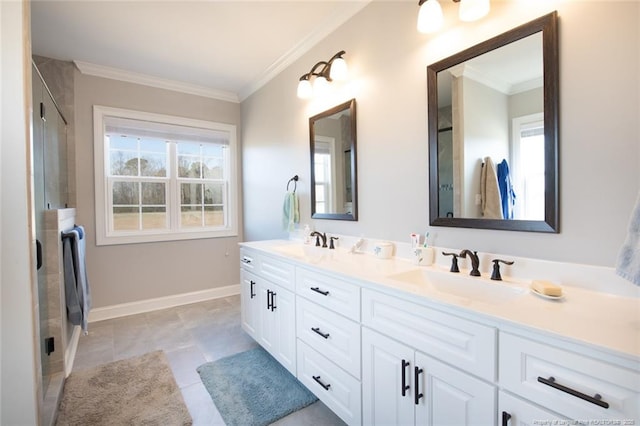 full bath with a sink, plenty of natural light, and crown molding