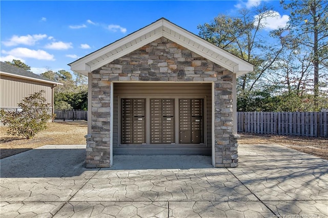 surrounding community with mail area and fence