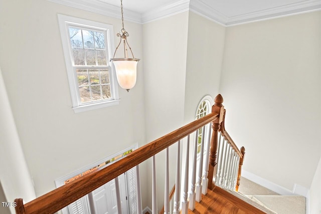 stairs with baseboards and ornamental molding