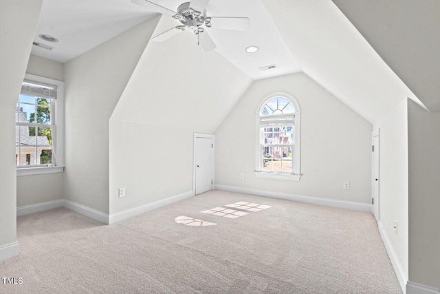 bonus room featuring vaulted ceiling, carpet, visible vents, and baseboards