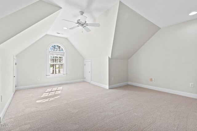 bonus room with visible vents, baseboards, vaulted ceiling, carpet floors, and a ceiling fan