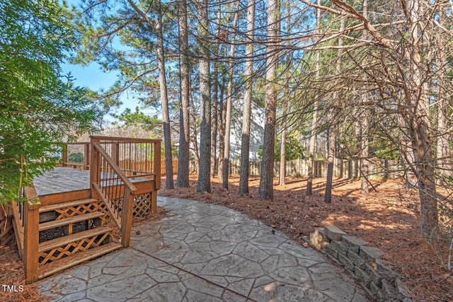 view of patio / terrace featuring fence and a wooden deck