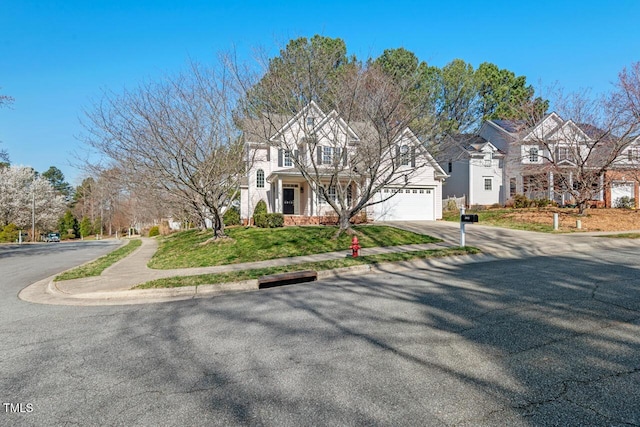 view of front of property with driveway and an attached garage