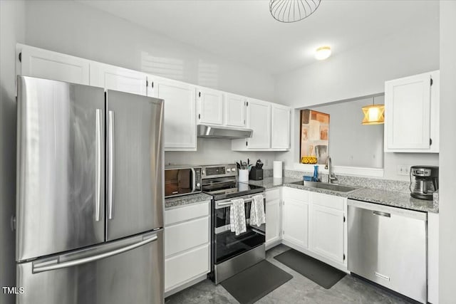 kitchen featuring under cabinet range hood, appliances with stainless steel finishes, white cabinetry, and a sink