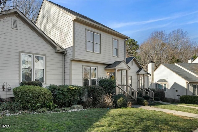 view of front of home with a front yard