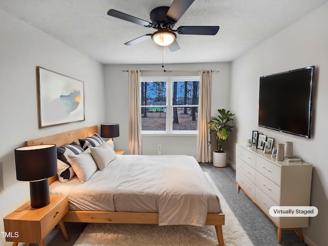 bedroom featuring light colored carpet and ceiling fan