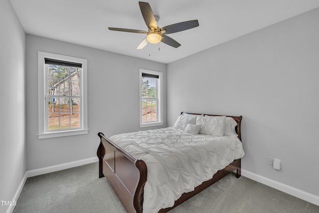 bedroom with a ceiling fan, carpet, and baseboards