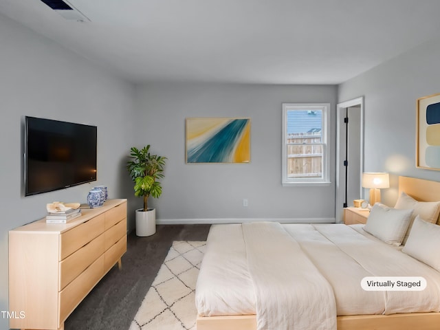 bedroom featuring carpet flooring, baseboards, and visible vents