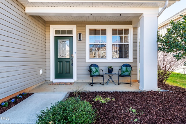 entrance to property featuring a porch