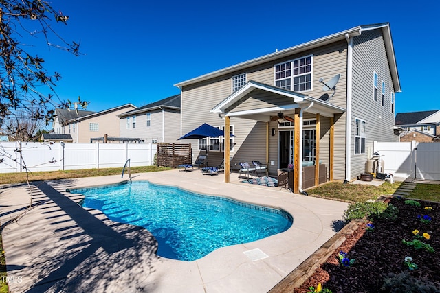 view of pool with a patio, a gate, a fenced in pool, a fenced backyard, and ceiling fan