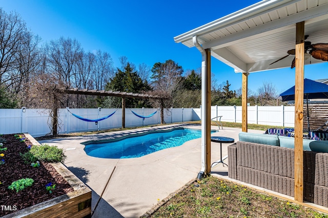 view of swimming pool with a patio area, a fenced in pool, a ceiling fan, and a fenced backyard