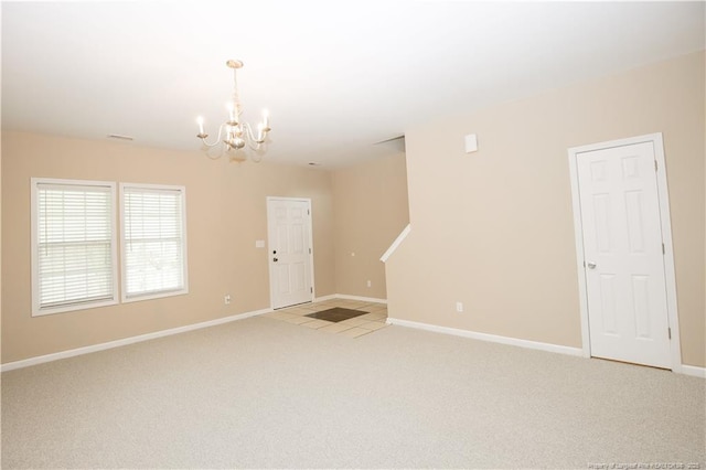 440 Moss Pink Dr, Vass, NC 28394 - unfurnished room with baseboards, an inviting chandelier, and light carpet